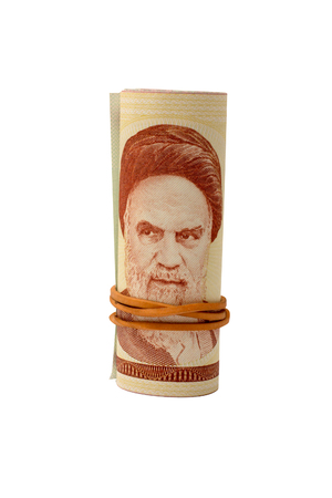 Rolled rial banknotes with a rubber ring, isolated