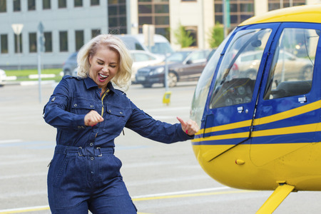 Blonde pilot invites to helicopter
