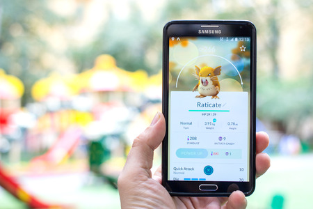AUG 03, 2016 MOSCOW, RUSSIA: Pokemon Go gameplay screenshot on the phone. Raticate pokemon on mobile phone screen. Pokemon Go is a modern location-based augmented reality mobile game.のeditorial素材
