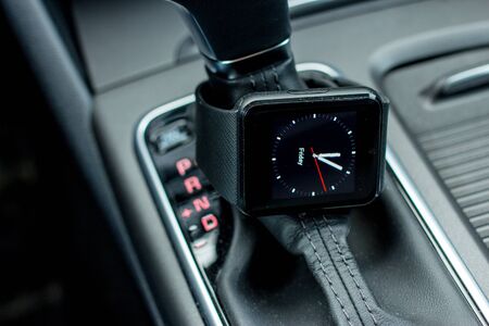 Modern car interior with smart watch on gear stick.の写真素材