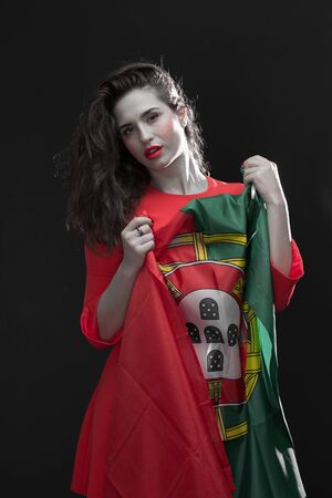 Beautiful brunette woman with Flag of Spain. Toned image.の写真素材