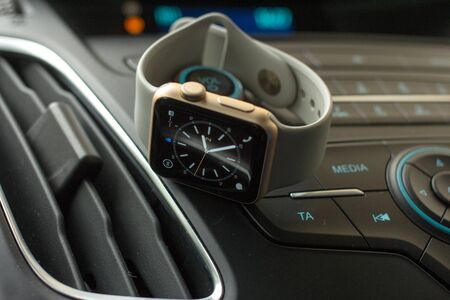 Smart watch on car dashboardの写真素材