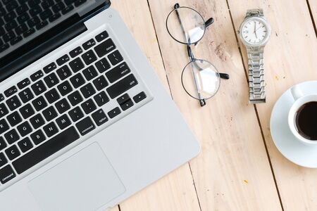 Business Still Life Concept. Glasses on modern laptop.の写真素材