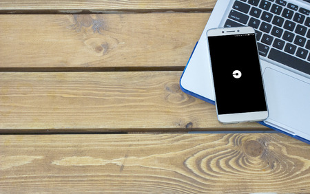 MAY 18, 2017 MOSCOW, RUSSIA: Uber application on smartphone screen placed on laptop keyboard. Empty...