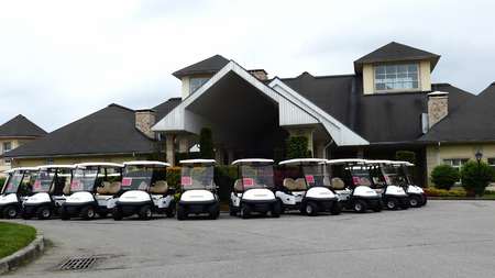 JUN 16, 2017 MOSCOW, RUSSIA: Group of golf cars in front of Aglalrov estate golf club.のeditorial素材