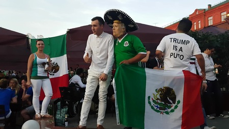 JUN 16, 2018 MOSCOW, RUSSIA: Mexican soccer funs with national flag and "Trump is a Puto" sign on T-shirtのeditorial素材