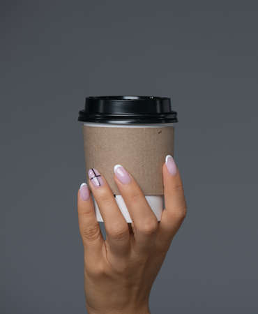 Take Away White Paper Hot Coffee Cup With Right Hand Holding.の写真素材