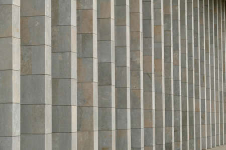 Element of the facade of the building consisting of vertical stone columnsのeditorial素材