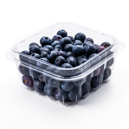 Blueberries in a store plastic box isolated. Blueberry, forest blue berry, bluberry pile , bilberry, fresh blueberries, huckleberry on white background.の写真素材