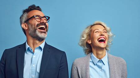 Photo of attractive emotional couple, man and woman friendly smile good mood wear office shirt isolated yellow backgroundの素材
