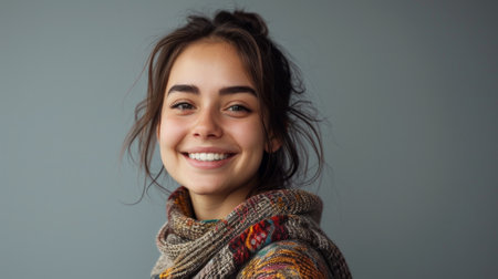 girl in a colored poncho. portrait of beautiful young woman in studioの素材