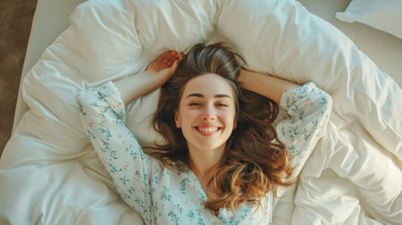 Beautiful Attractive Asian woman sleep and sweet dream lying on bed in cozy bedroom in the morning feeling so relax and comfortable.Healthy Young female sleep with bedtime at home.Healthcare Conceptの素材