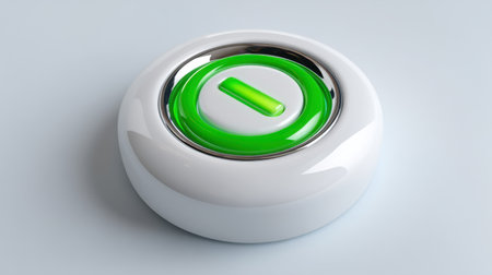 A green circular power button sits on a smooth white surface, featuring a metallic silver rim. This design is suitable for modern electronic gadgets. Its vibrant color and shape are eye-catching.の素材