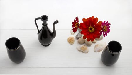 Tea and the sea with red flowers.の写真素材