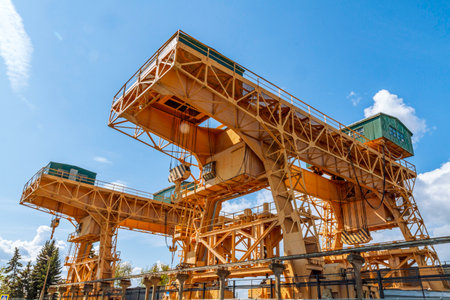 Heavy construction of overhead crane under blue sky.の写真素材