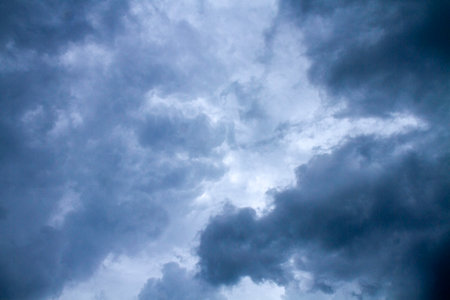 Dramatic stormy sky with dark clouds before heavy rain.