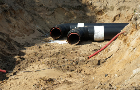 Construction work. Pipe laying. Repair of communications.の写真素材