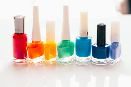 colored nail polish on a white background.の写真素材