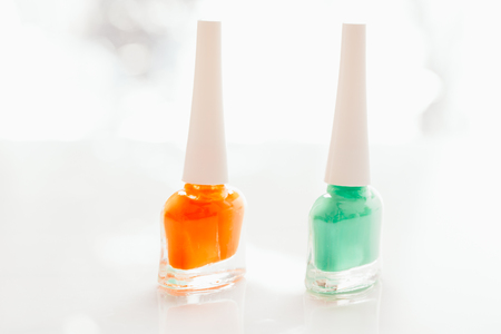 colored nail polish on a white background.の写真素材
