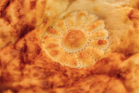 National Uzbek bread on a wooden background, close-up.の写真素材