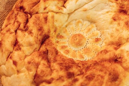 National Uzbek bread on sackcloth, top view.の写真素材
