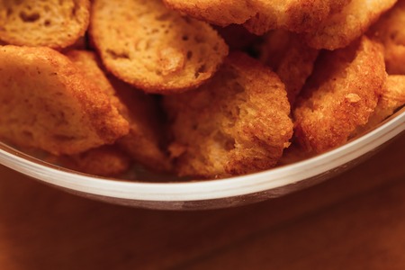 crisp fresh rusk bowl on a wooden background.の写真素材