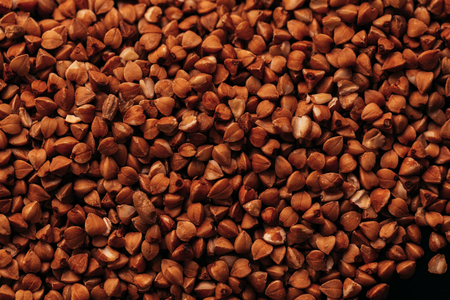 lots of fresh buckwheat scattered background close-up.の写真素材