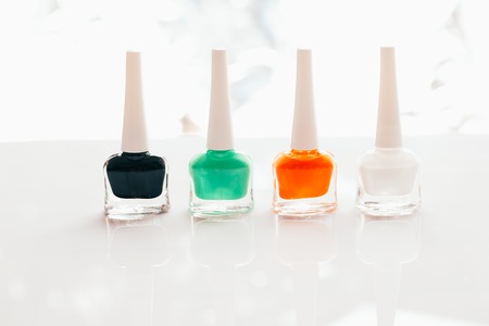 colored nail polish on a white background.の写真素材
