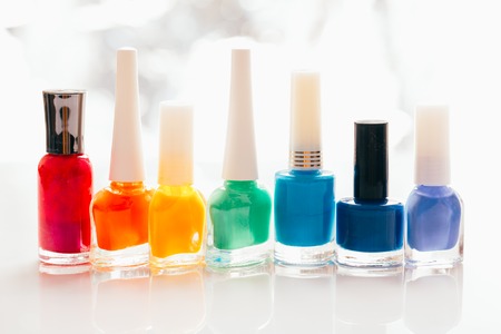 colored nail polish on a white background.の写真素材