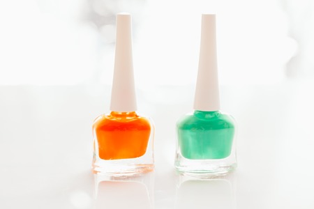 colored nail polish on a white background.の写真素材