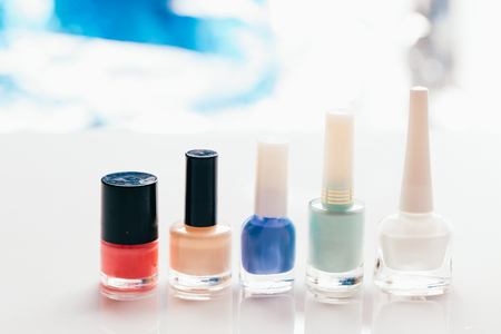 colored nail polish on a blurred background.の写真素材