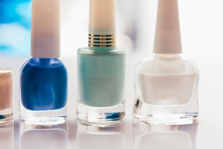 colored nail polish on a blurred background.の写真素材