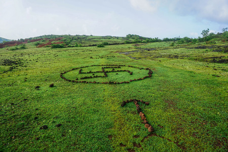 Symbols of stones on green grassの写真素材