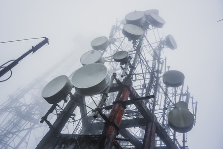 Tower with radio antennas in the fog. Tiger Hill near the town of Darjelling. Indiaの写真素材