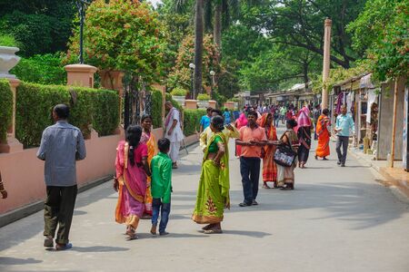 Mayapur, India - April 9, 2017: Residents of the village of Mayapur stroll along the streets of...