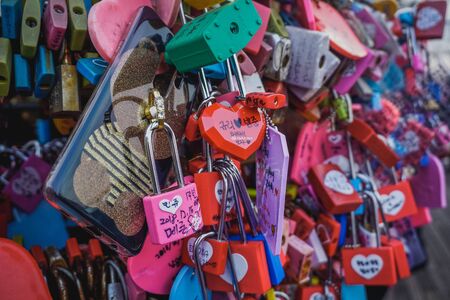Seoul, South Korea - December 16, 2018: A thousand love locks with wishes on a fence in Namsan Park.のeditorial素材