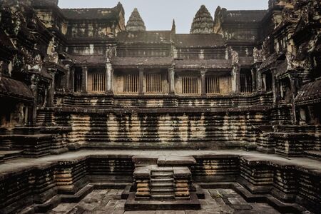 Ancient architecture and ruins of Angkor Wat early in the morningの写真素材