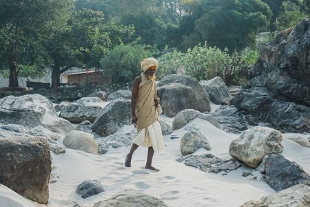 Rishikesh, India - November 3, 2017: Local yogi on a city beach