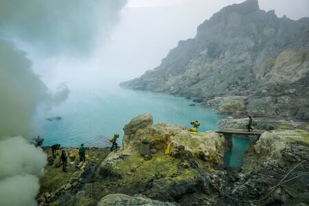 Ijen Volcano, Indonesia - April 1, 2018: Workers mine sulfur from the crater of the volcanoのeditorial素材