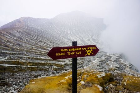 Ijen Volcano, Indonesia - April 1, 2018: Ijen volcano banners warning of the danger of descent to the craterのeditorial素材