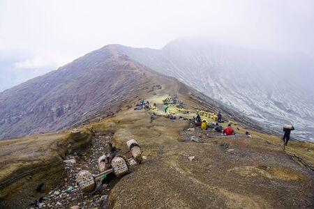 Ijen Volcano, Indonesia - April 1, 2018: Workers mine sulfur from the crater of the volcanoのeditorial素材