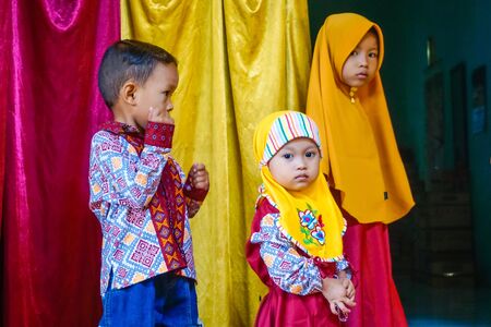 West Java, Indonesia - April 12, 2018: Indonesian children at a wedding ceremonyのeditorial素材