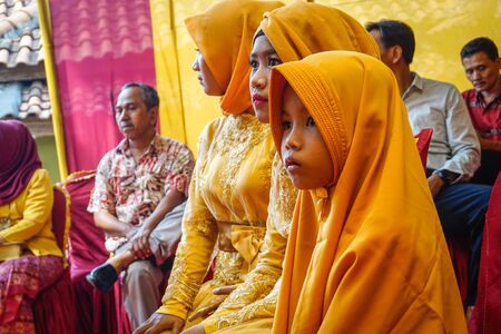 West Java, Indonesia - April 12, 2018: Indonesian children at a wedding ceremonyのeditorial素材