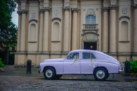Warsaw, Poland - July 16, 2018: Old retro car on the background of a historic building in Warsawのeditorial素材