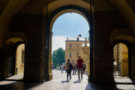KRAKOW, POLAND - July 21, 2018: Tourists walking through the arch to the Cathedral of Saints Stanislav and Wenceslasのeditorial素材