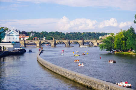 Prague, Czech Republic - July 28, 2018: Tourists ride catamarans on the Vltava Riverのeditorial素材