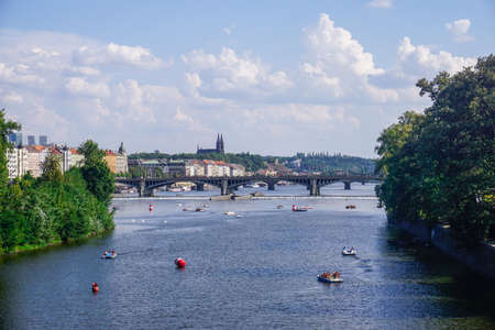 Prague, Czech Republic - July 28, 2018: Tourists ride catamarans on the Vltava Riverのeditorial素材