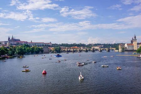 Prague, Czech Republic - July 28, 2018: Tourists ride catamarans on the Vltava Riverのeditorial素材
