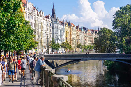 Prague, Czech Republic - July 28, 2018: Beautiful water canal, architecture and many tourists walking around the city.のeditorial素材