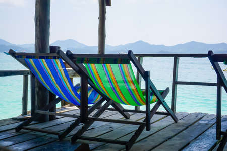 Sun loungers are waiting for tourists on Phi Phi in Thailandの写真素材
